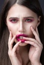 Girl with pink lipstick smeared across his face. Creative makeup. Royalty Free Stock Photo