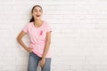 Girl In Pink Ribbon T-Shirt Laughing Standing Near White Wall Royalty Free Stock Photo