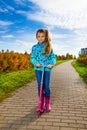Girl with pink scooter Royalty Free Stock Photo