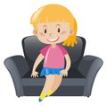 Girl in pink sitting on gray sofa