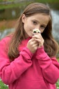 Girl picked herself a small bouquet of  daisy flowers Royalty Free Stock Photo