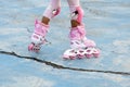 Girl pink uniform playing roller blade. Royalty Free Stock Photo