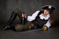 Girl - pirate with sabre and bottle Royalty Free Stock Photo