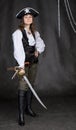 The girl - pirate with a sabre in hands