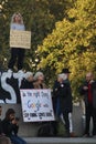 Girl With Placard On Nelson`s Column.. Royalty Free Stock Photo