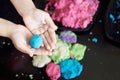 Girl plaing magic kinetic sand. Black box