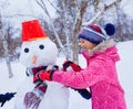 Girl plaing in the snow Royalty Free Stock Photo