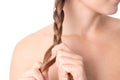 Girl he plaits the braid with your hands close-up