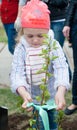 Girl plants tree