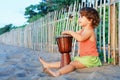 Girl play ethnic music on traditional african hand drum djembe Royalty Free Stock Photo