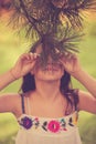 Girl play with evergreen needles Royalty Free Stock Photo