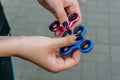 Girl play with fidget spinner stress relieving toy Royalty Free Stock Photo