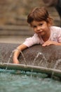 Girl play in fountain