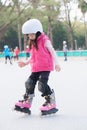 Girl play roller skating Royalty Free Stock Photo