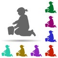 Girl play in sand bucket silhouette multi color style icon. Simple glyph, flat vector of children icons for ui and ux, website or Royalty Free Stock Photo