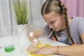 Girl play with yellow slime inflates bubble fun at home