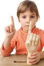 Girl is played by wooden hand of manikin isolated Royalty Free Stock Photo