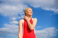 Girl playful mood coquette. Flirt and coquette concept. Sunlight pleasant warm. Woman red dress feels carefree and free Royalty Free Stock Photo