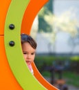 Girl on the playground playing hide and seek Royalty Free Stock Photo