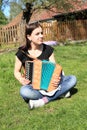 Girl playing on an accordion Royalty Free Stock Photo