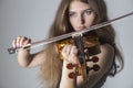 Girl playing an acoustic violin Royalty Free Stock Photo