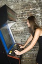 Girl Playing an Arcade Game