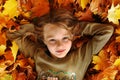 Girl playing with autumn leaves up in the air Royalty Free Stock Photo