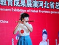 Girl in playing the bamboo flute Royalty Free Stock Photo