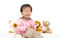 Girl playing with bear and hippo toy Royalty Free Stock Photo