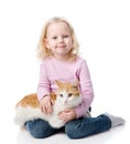 Girl playing with cat. looking at camera. Royalty Free Stock Photo