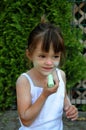 Girl paints her face with chalk