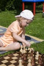 Girl playing chess Royalty Free Stock Photo