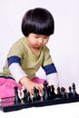 Girl playing chess Royalty Free Stock Photo