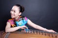 Girl playing Chinese zither Royalty Free Stock Photo
