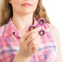 Girl playing with a colourful hand fidget spinner toy Royalty Free Stock Photo