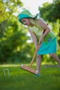 Girl playing croquet Royalty Free Stock Photo
