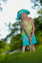 Girl playing croquet Royalty Free Stock Photo