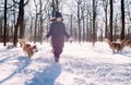 Girl playing with dog in snow