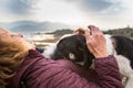 Girl playing with a dog while traveling Royalty Free Stock Photo