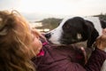 Girl playing with a dog while traveling Royalty Free Stock Photo