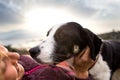 Girl playing with a dog while traveling Royalty Free Stock Photo