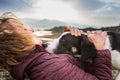 Girl playing with a dog while traveling Royalty Free Stock Photo