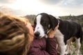 Girl playing with a dog while traveling Royalty Free Stock Photo