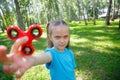 Girl playing with a fidget spinner