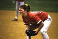 A girl playing first base in a softball game