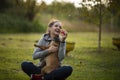 Girl playing with French Billdog at the park Royalty Free Stock Photo