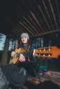 Girl Playing the Guitar