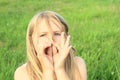 Girl playing on halm of grass Royalty Free Stock Photo