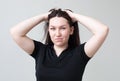 Girl playing with her hair grins Royalty Free Stock Photo