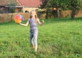Girl playing with inflating ball Royalty Free Stock Photo